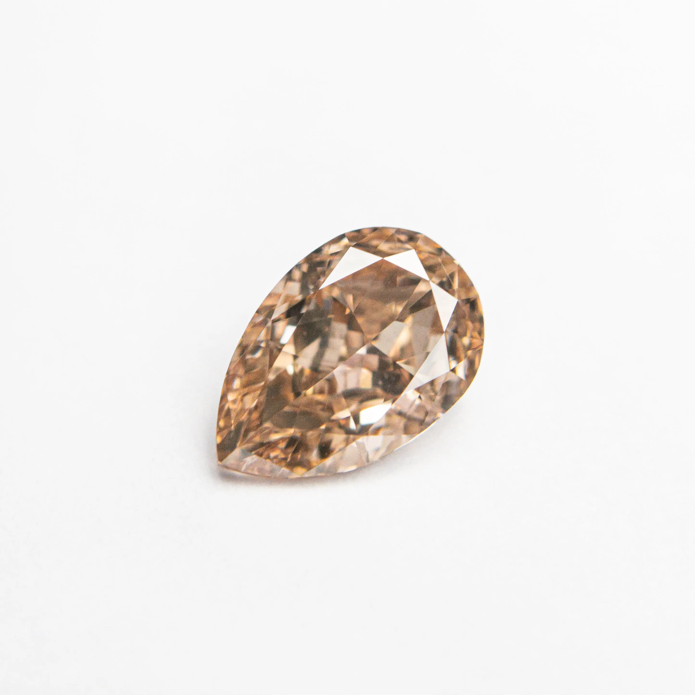 0.68ct 7.06x4.68x2.76mm VS2 Fancy Brownish Pink Pear Brilliant  24112-01