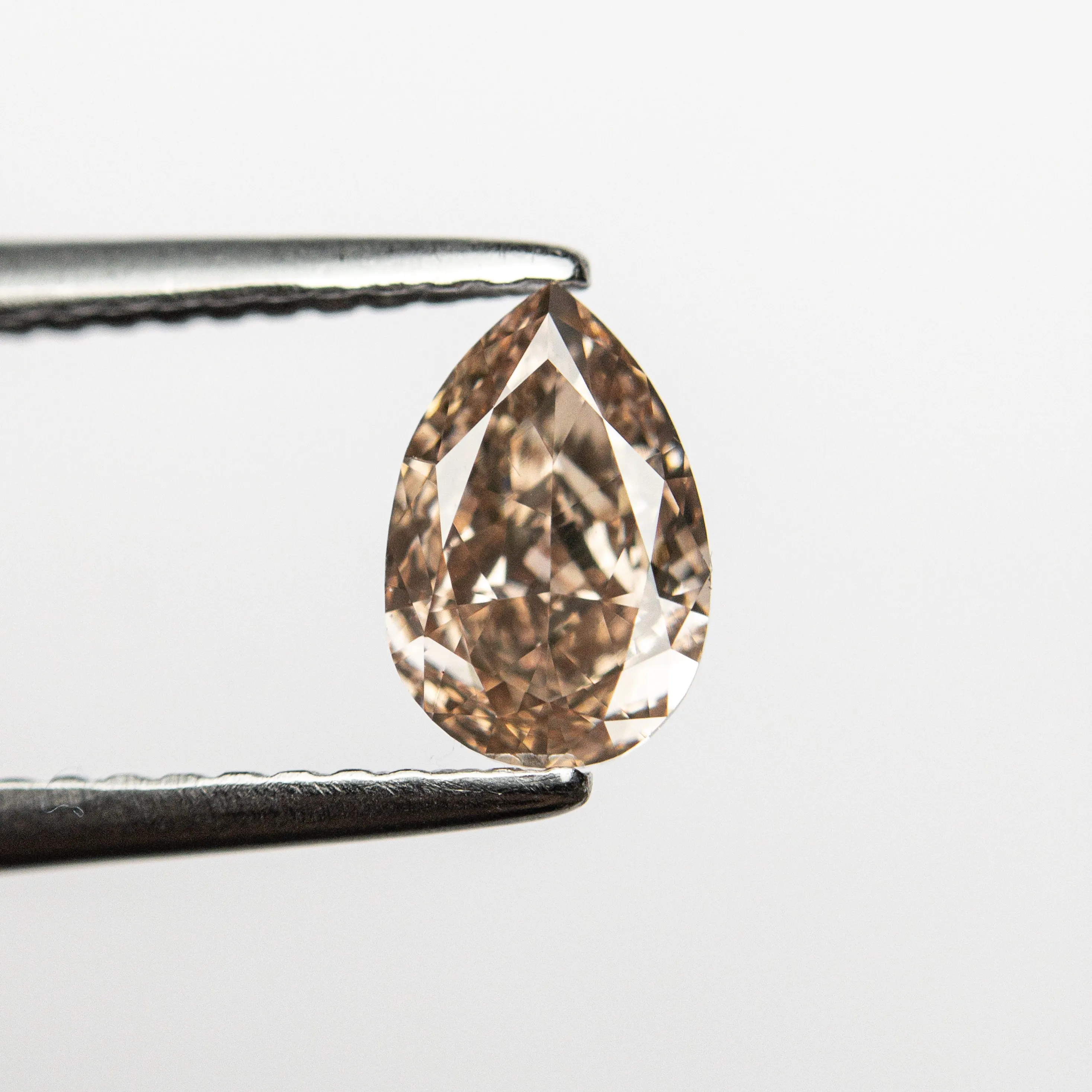 0.68ct 7.06x4.68x2.76mm VS2 Fancy Brownish Pink Pear Brilliant  24112-01