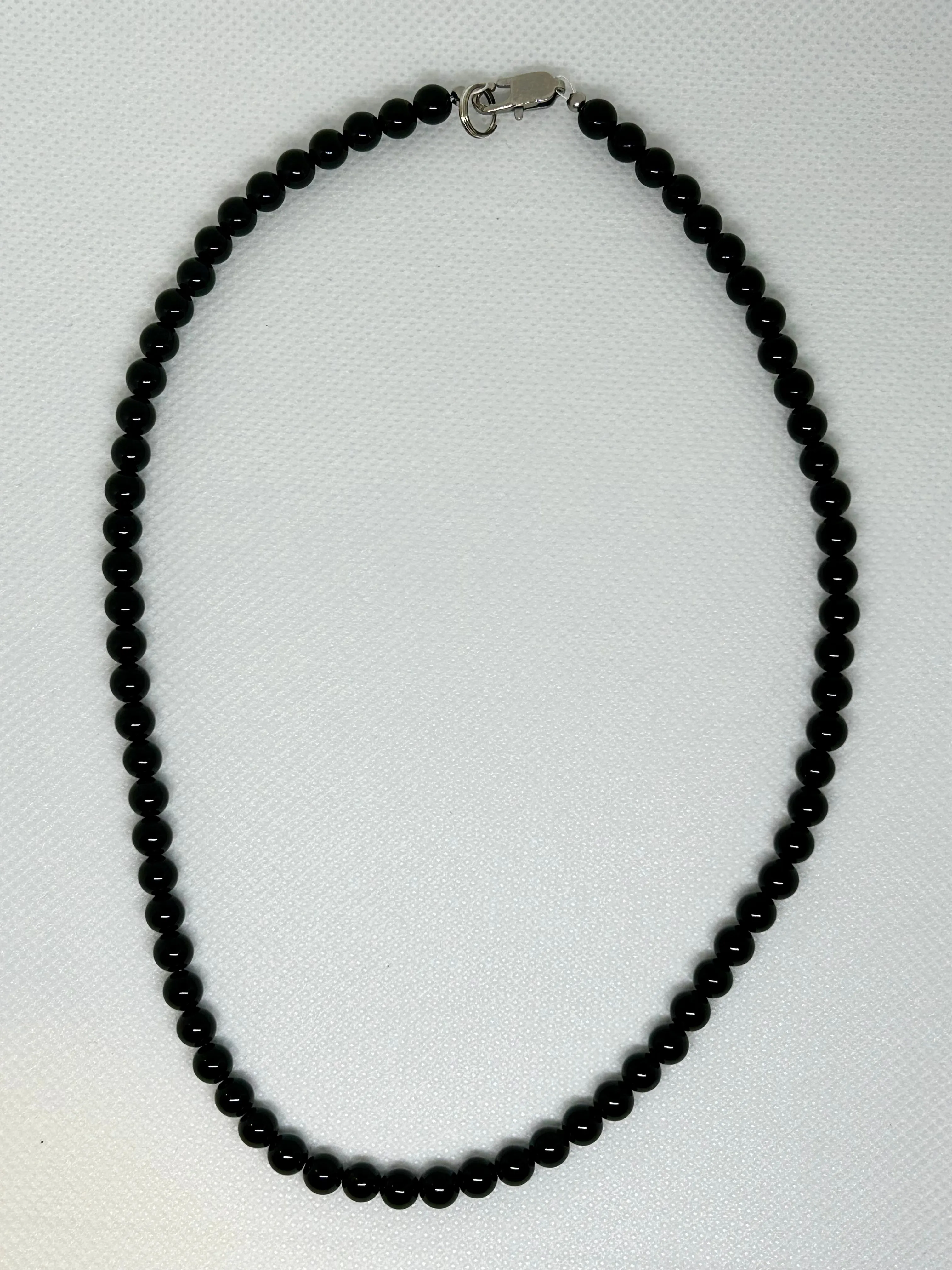 Genuine Black Onyx stone necklace with hypoallergenic stainless steel clasp.  18”. EP115